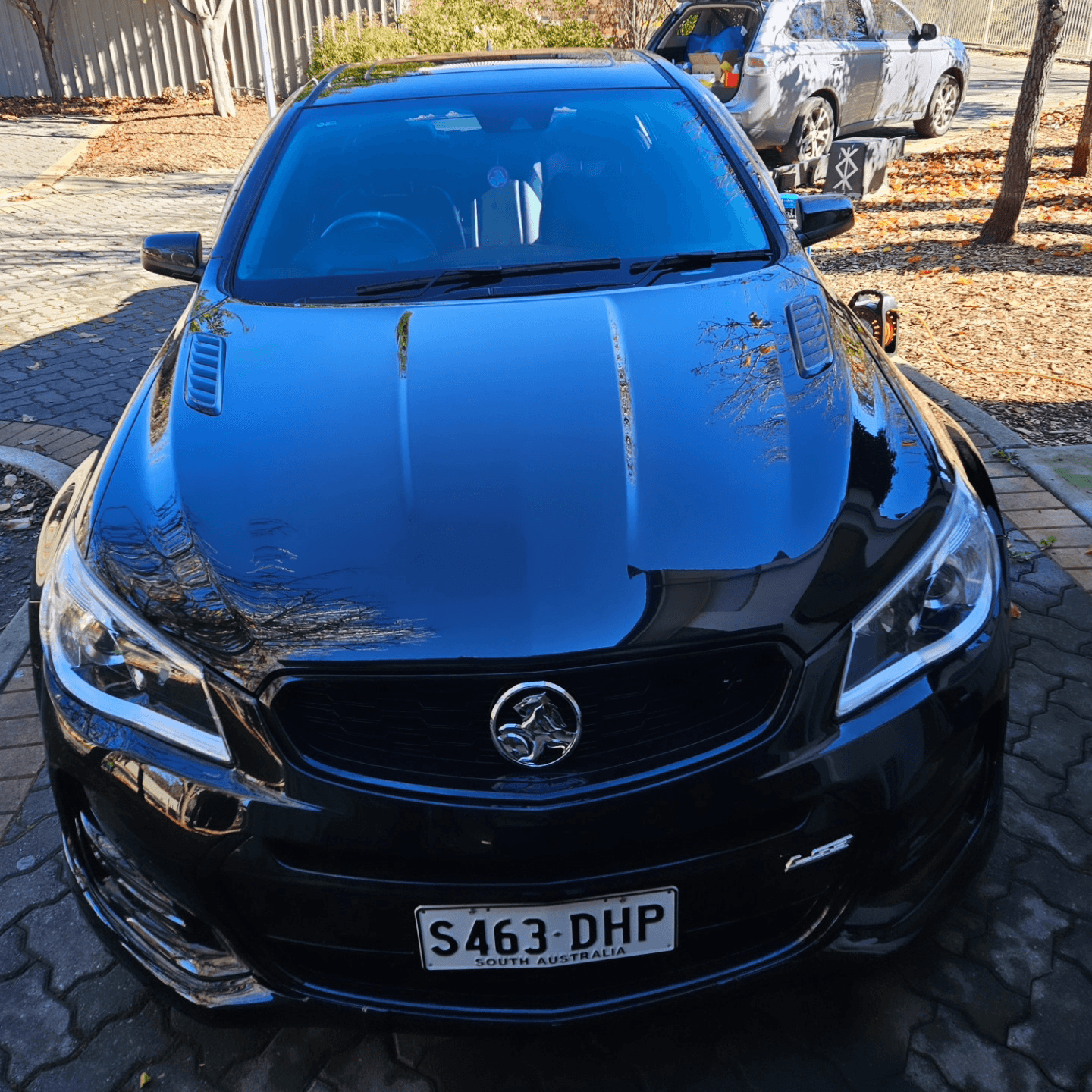 Polished black Holden Commodore after a full exterior detail