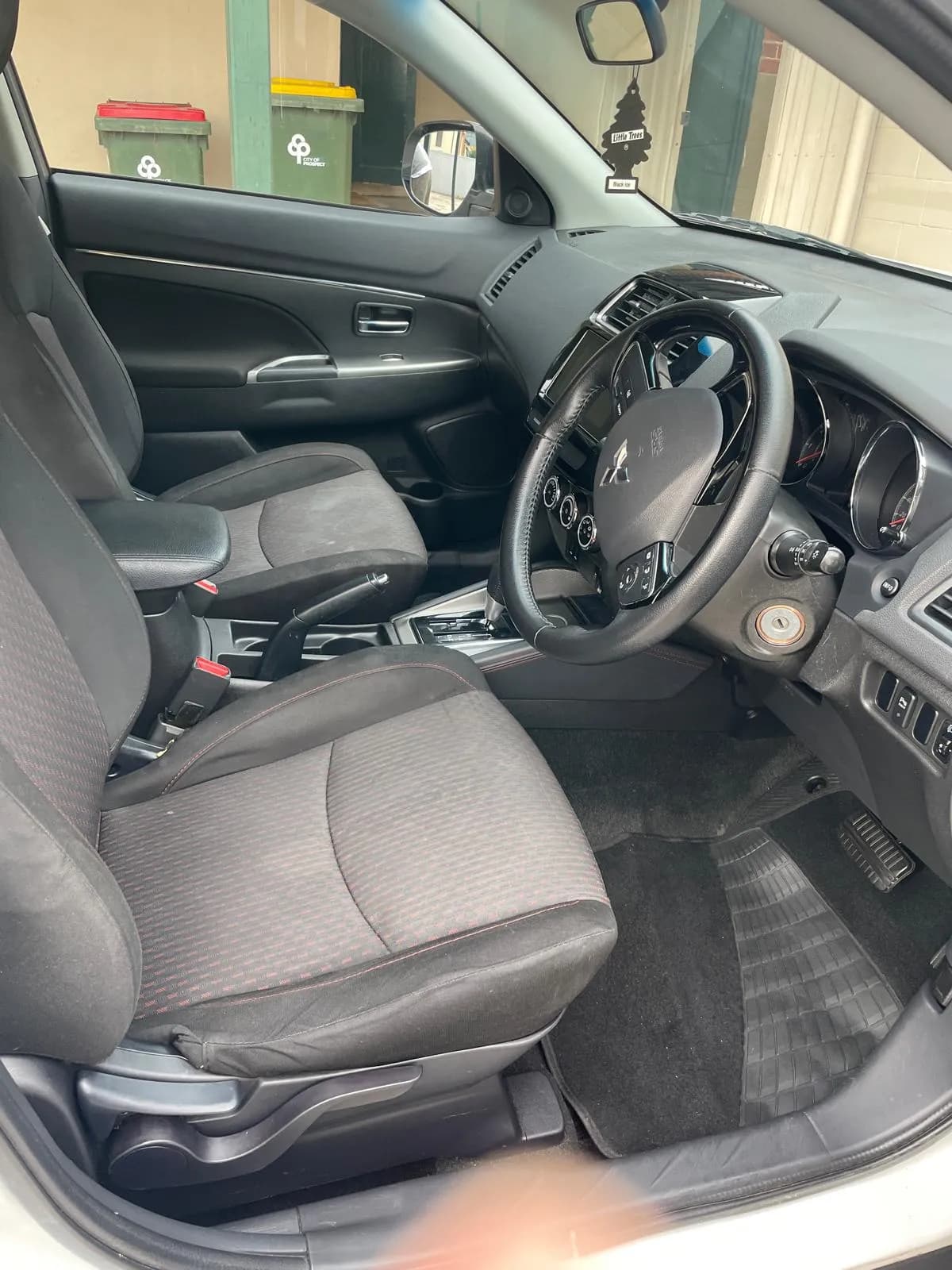 Detailed car interior with a protected steering wheel