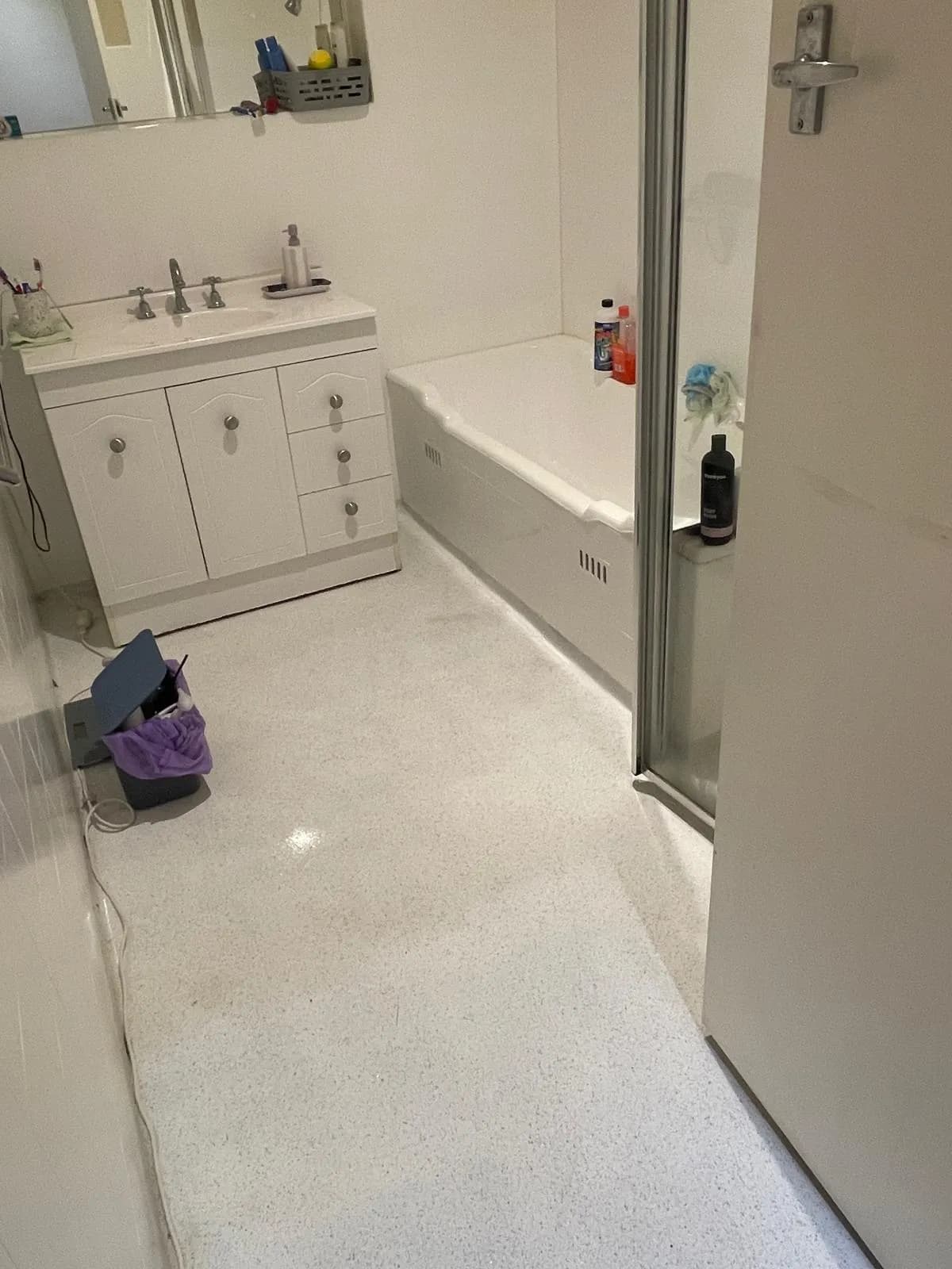 Bathroom vanity and bath scrubbed during a bond clean